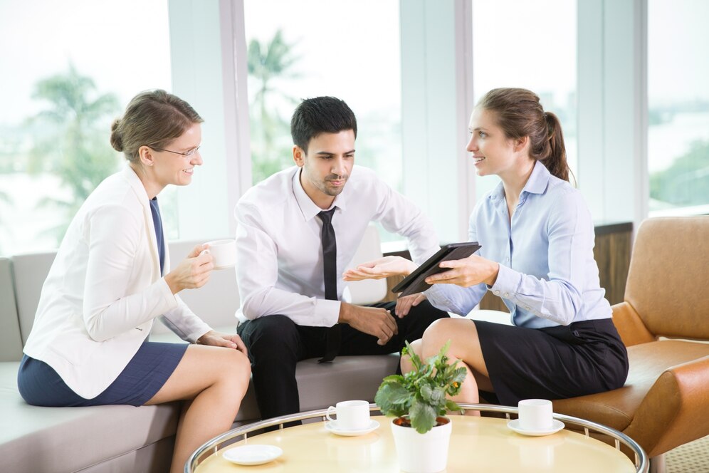 Hospitality consultants guiding hotel staff on guest service improvements